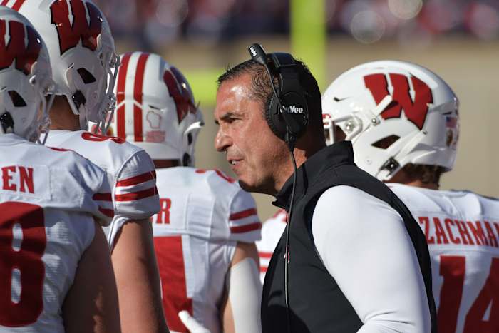 Wisconsin Badgers head coach Luke Fickell talks to his players during the first half against the Illinois Fighting Illini at Memorial Stadium.